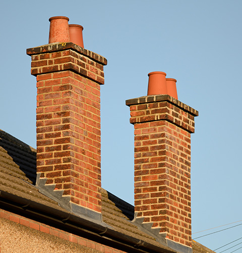 chimney stacks on top of a house